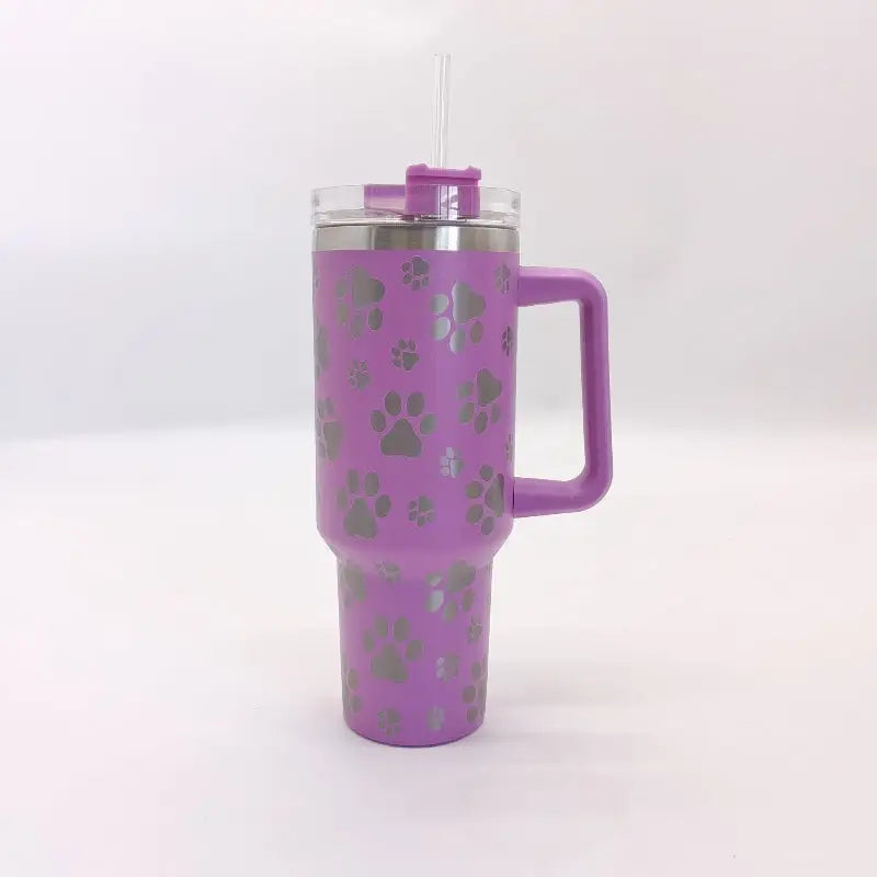 Purple paw-print travel mug with handle.
