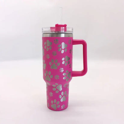 Pink tumbler with paw prints.