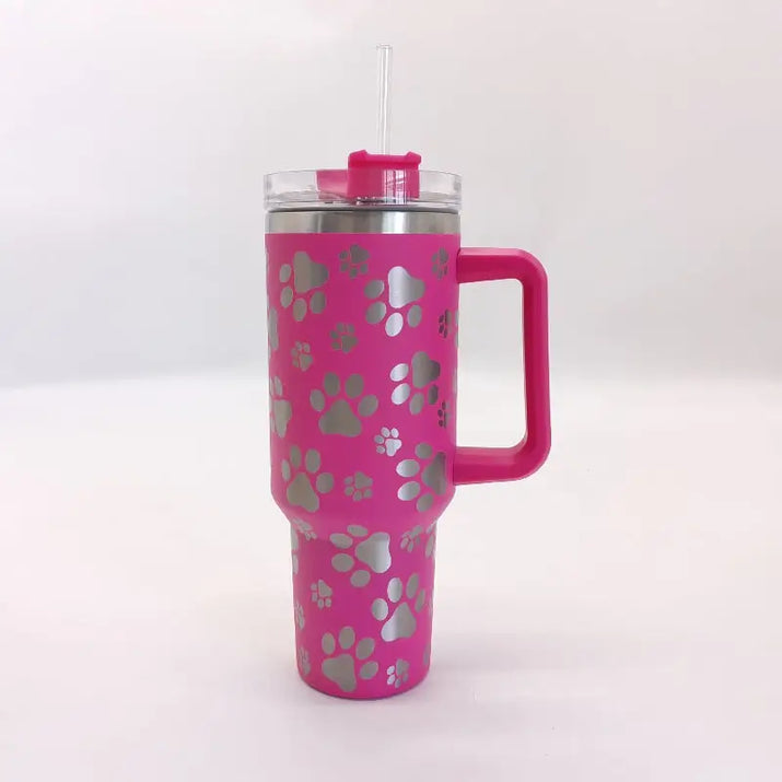 Pink tumbler with paw prints.