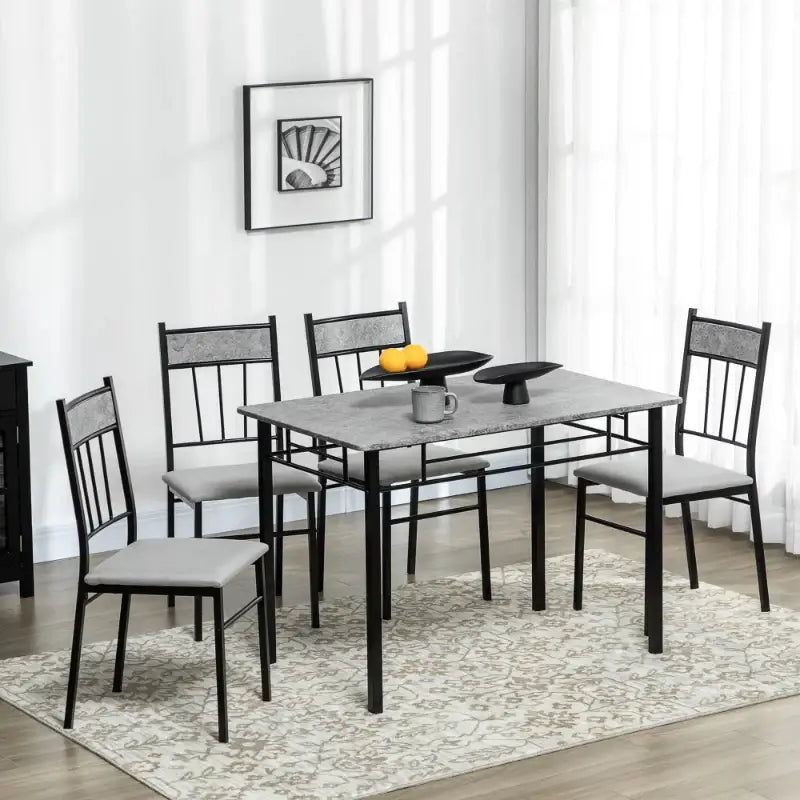 Dining table set with four chairs.