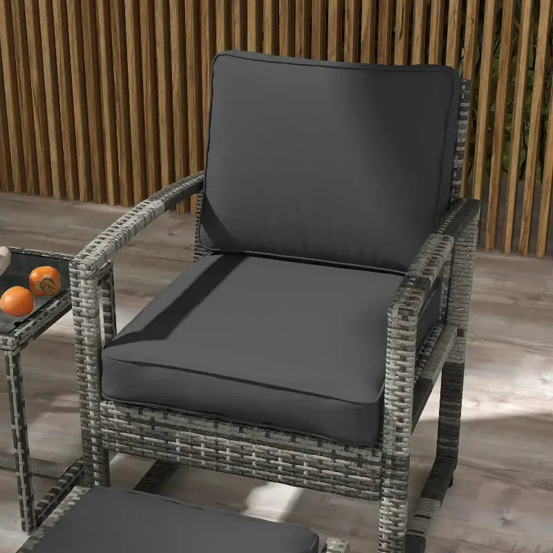 Gray wicker chair with cushions.