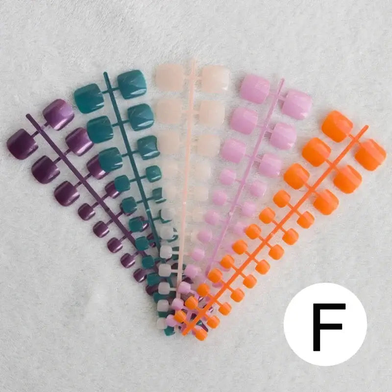 Colorful artificial toenail sets.