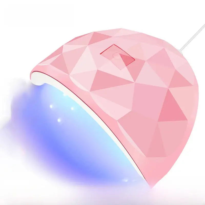Pink, faceted, UV nail lamp.