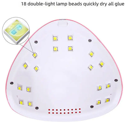 Pink and white nail lamp with LED lights.