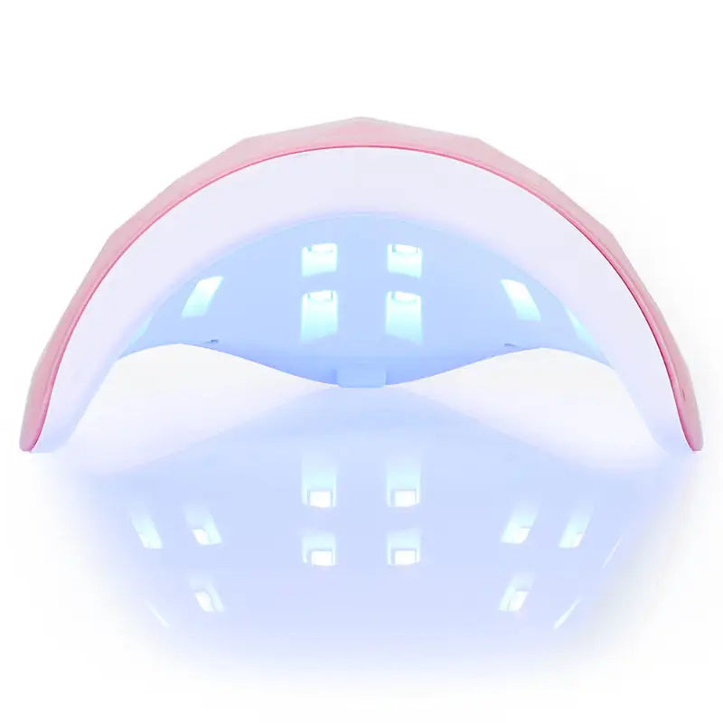 Pink and white nail curing lamp.