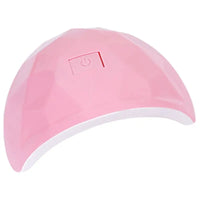 Pink, faceted nail lamp with power button.