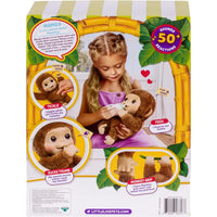 Box of a toy monkey with interactive features and a girl playing with it.