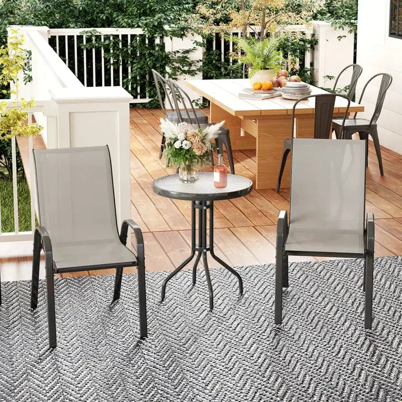 Light grey outdoor patio bistro set with chairs and table for stylish dining