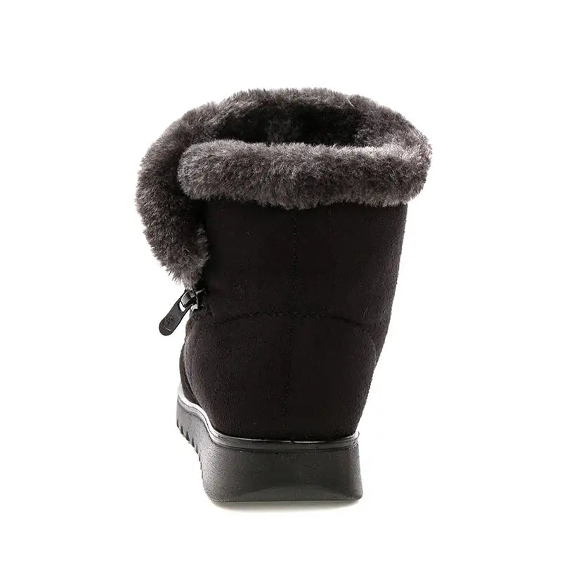 Black winter boot with gray fur lining on a white background