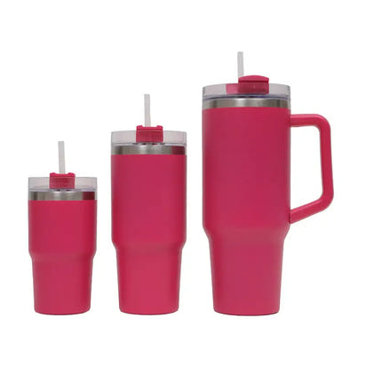 Set of three pink insulated tumblers with straws on a white background