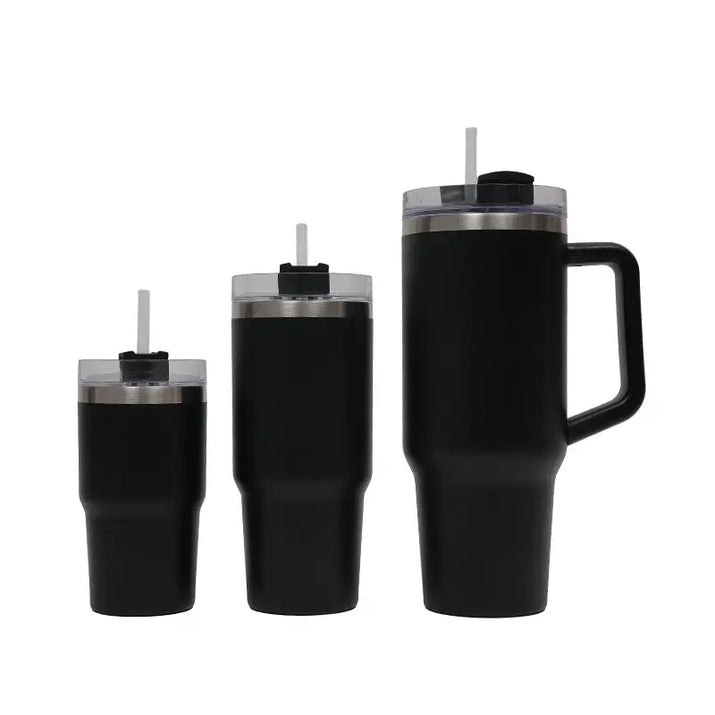 Set of black insulated tumblers with handles and straws on a white background