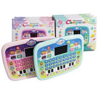 Colorful toy educational computer with keyboard and screen, surrounded by packaging on a white background.