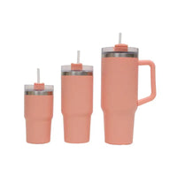 Set of three peach-colored tumblers with straws on a white background