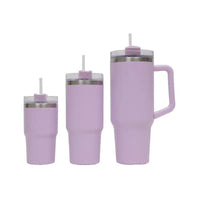Set of three purple insulated tumblers with straws on a white background