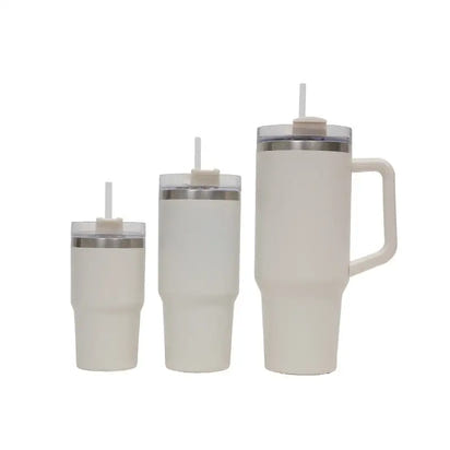 Set of three white insulated tumblers with handles on a white background