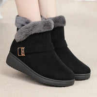 Black winter boots with gray fur trim on a neutral background