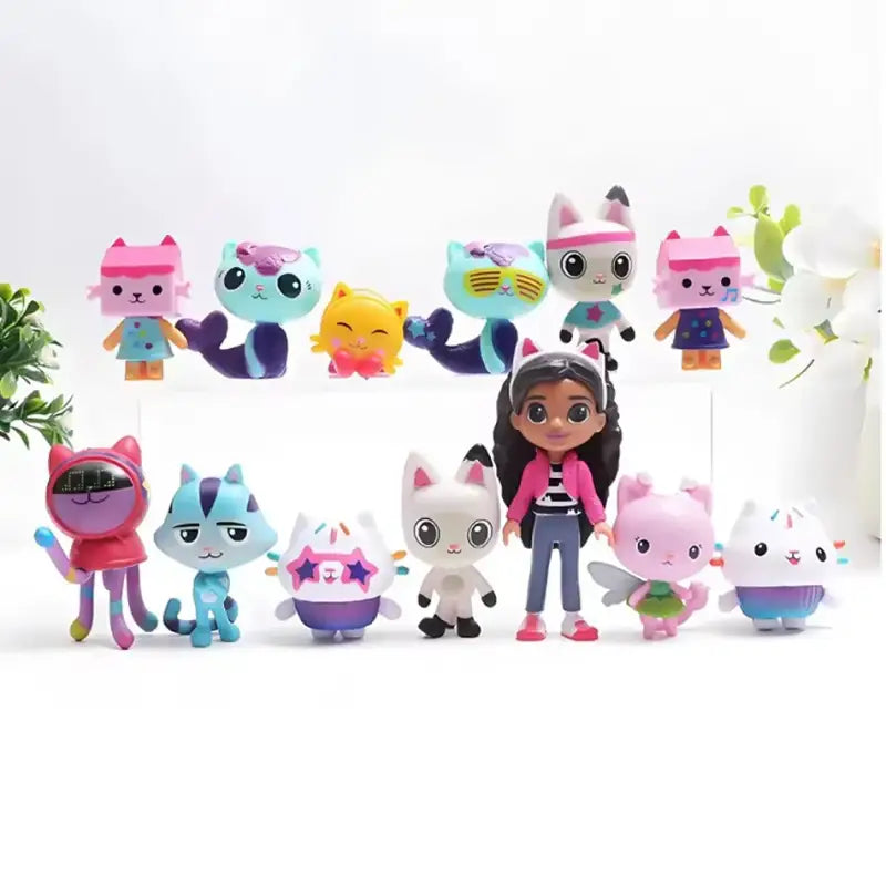 Doll with a collection of colorful cat-themed figurines on a white background