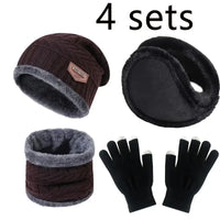 Set of winter accessories including a beanie, ear muffs, scarf, and gloves on a white background.