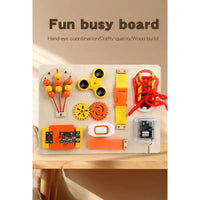 Fun busy board with various educational components on a wooden surface.