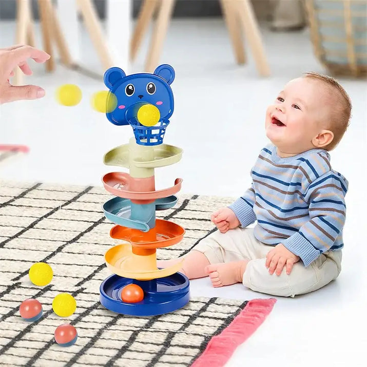 Baby playing with a colorful toy on a checkered floor