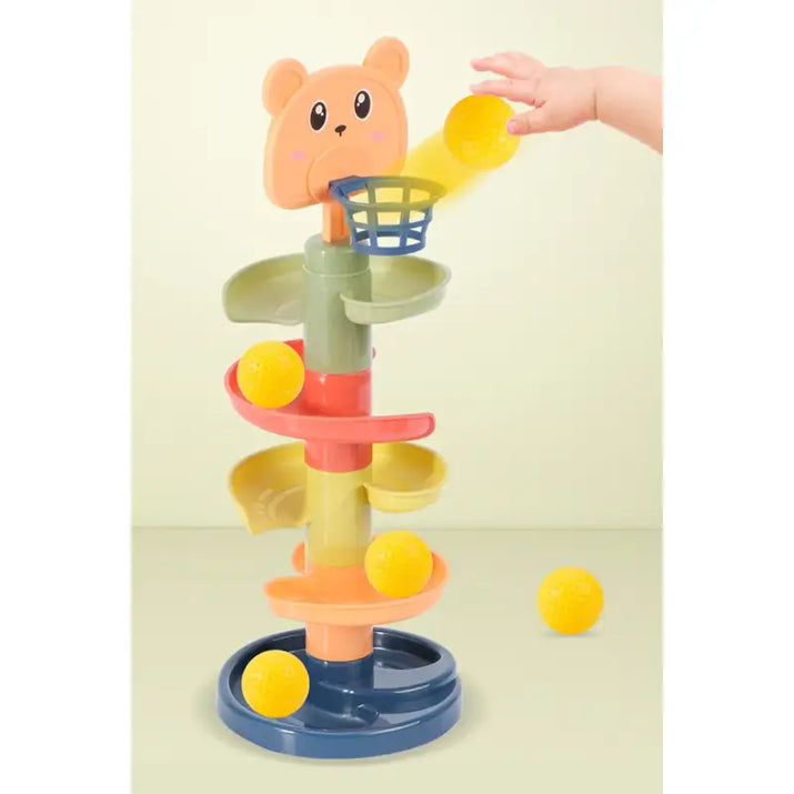 Colorful toy with a bear-like top and multiple levels on a light green background