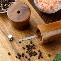 Wooden pepper grinder.