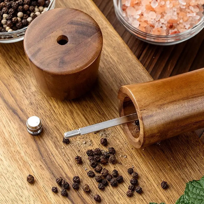 Wooden pepper grinder.