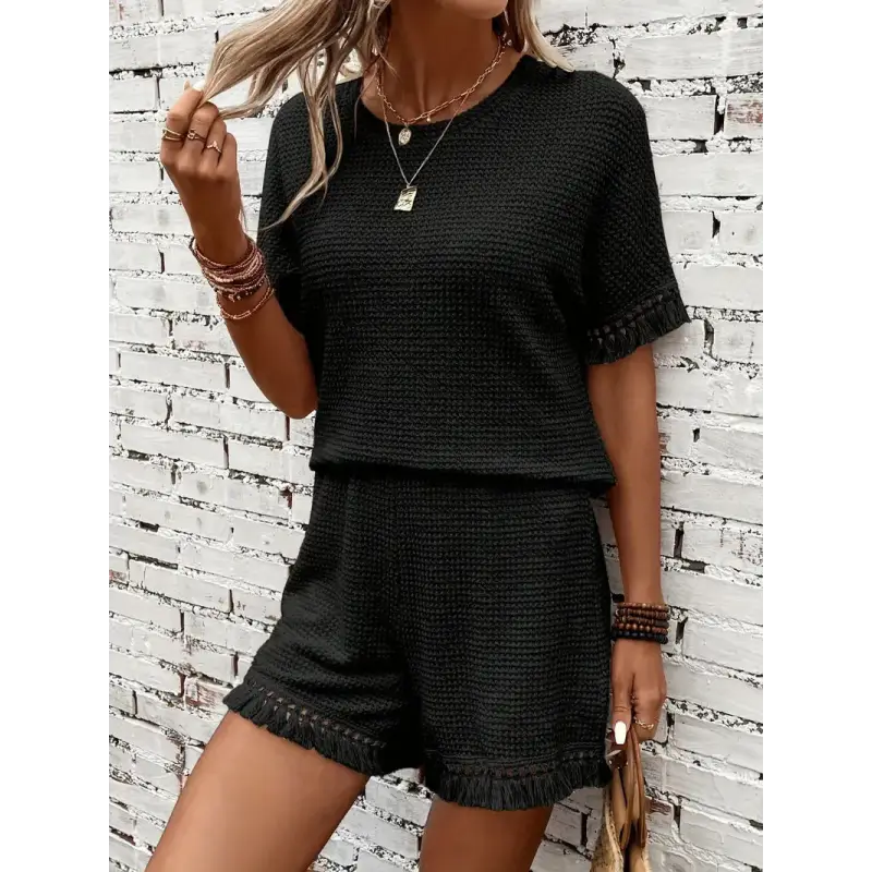 Black knit two-piece shorts set.
