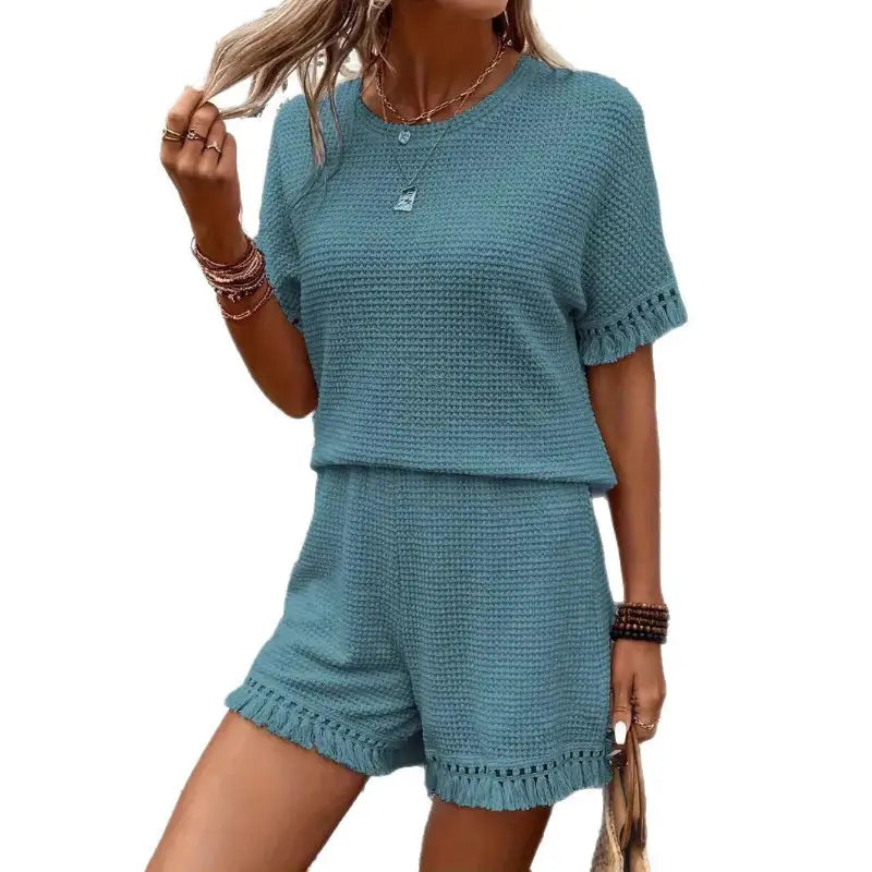 Teal waffle-knit shorts set with fringe.
