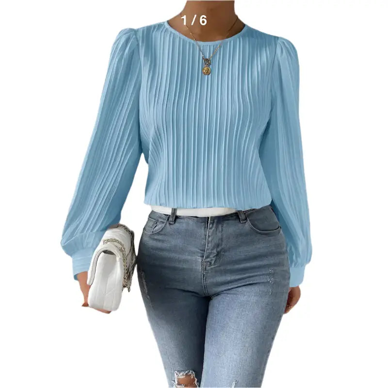 Light blue pleated blouse with jeans.