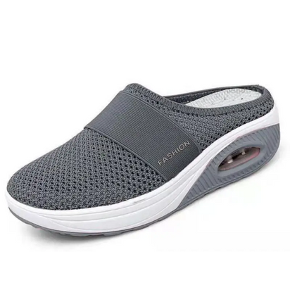 Gray mesh slip-on shoe with white sole.