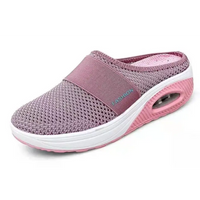 Pink mesh slip-on shoe with air cushion sole.