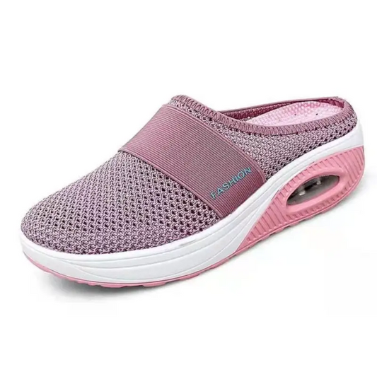 Pink mesh slip-on shoe with air cushion sole.