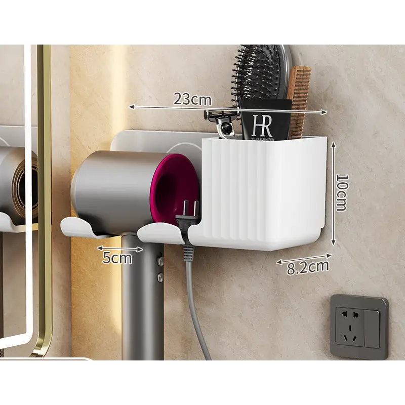 Wall-mounted hair dryer and accessory holder.
