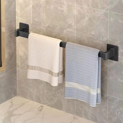 Black towel rack with towels.
