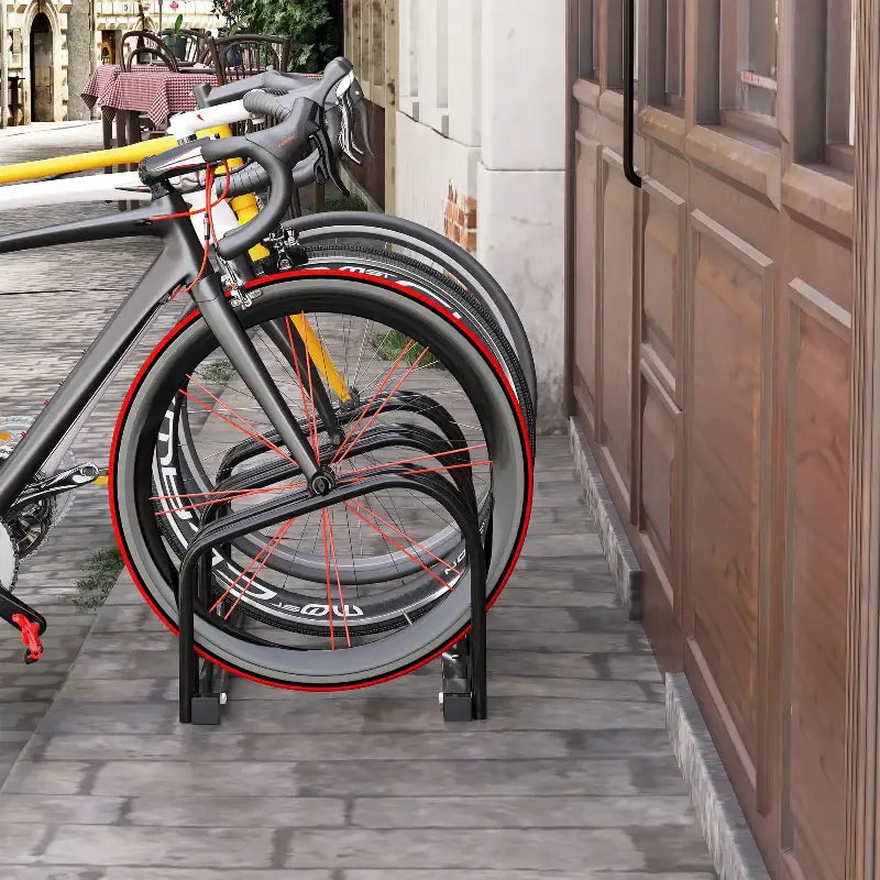 Bicycles parked in a metal rack.