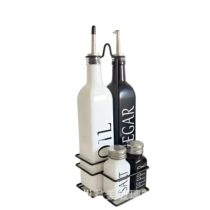 Oil, vinegar, salt, and pepper set in a black metal rack.