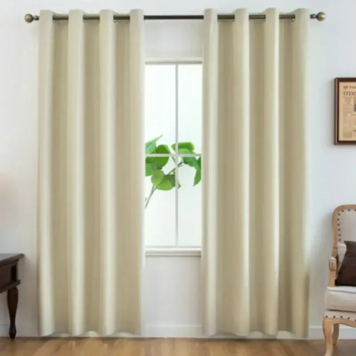 Beige grommet curtains.