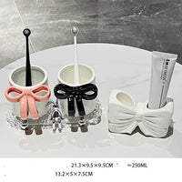 Bathroom set with bow accents.