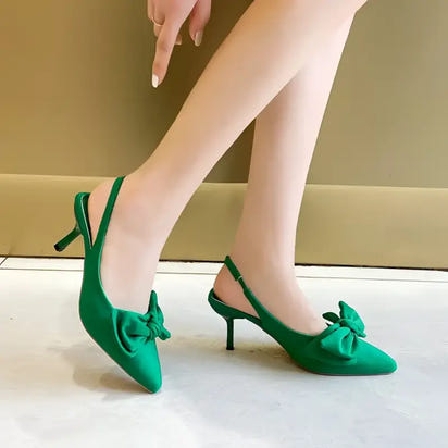 Green slingback heels with bow.