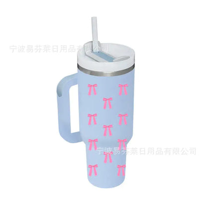 Light blue tumbler with pink bows.