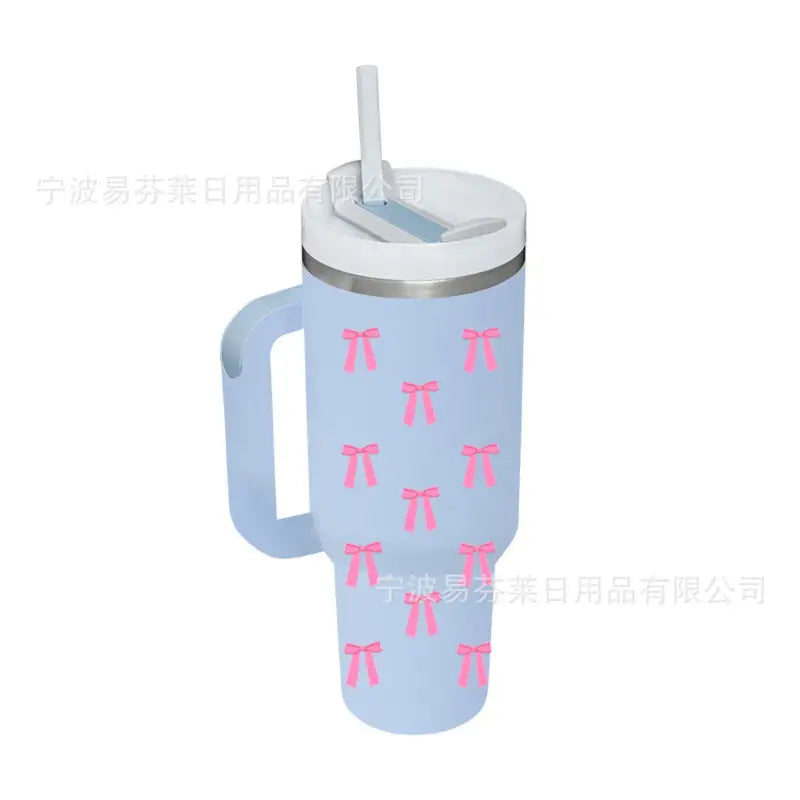 Light blue tumbler with pink bows.