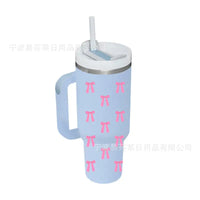 Light blue tumbler with pink bows.