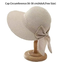 Beige straw sun hat with bow.