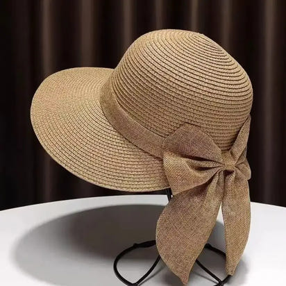 Tan straw sun hat with bow.