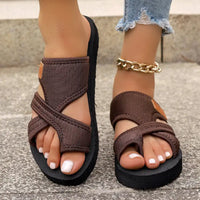 Brown toe-ring platform sandals.