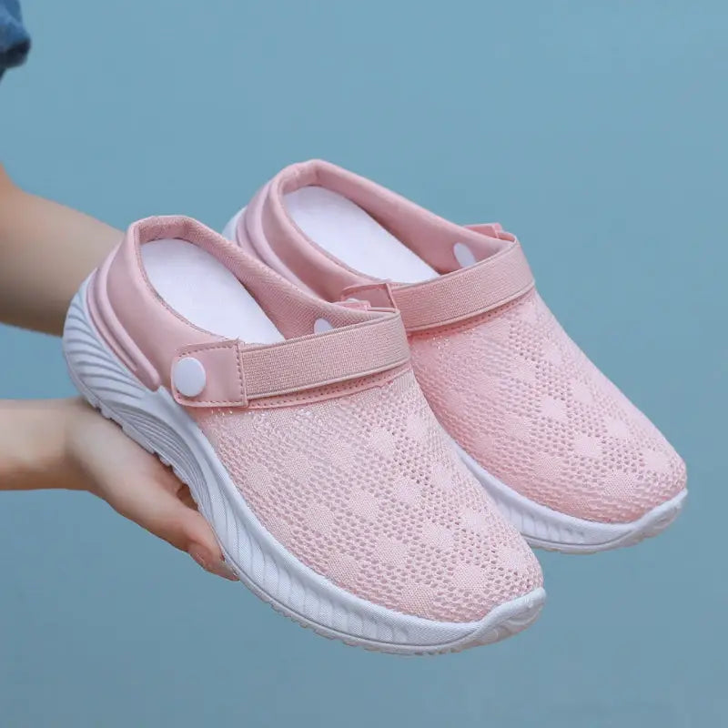 Pink mesh slip-on shoes.