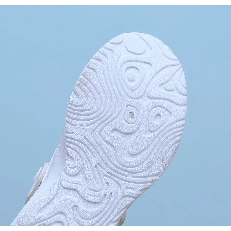 White shoe sole with topographic pattern.