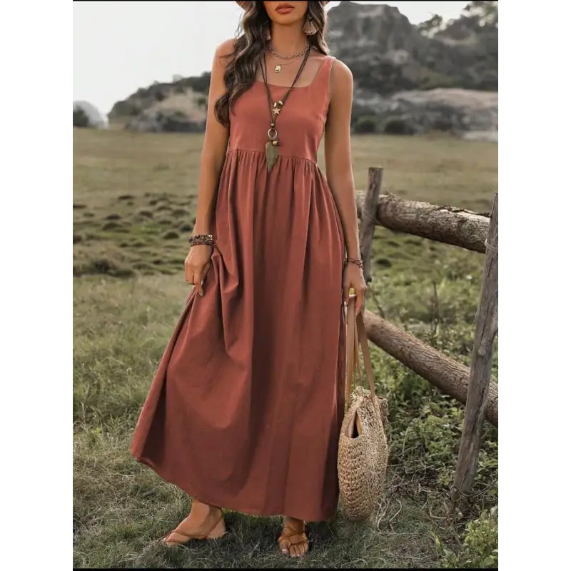 Rust-colored sleeveless maxi dress.