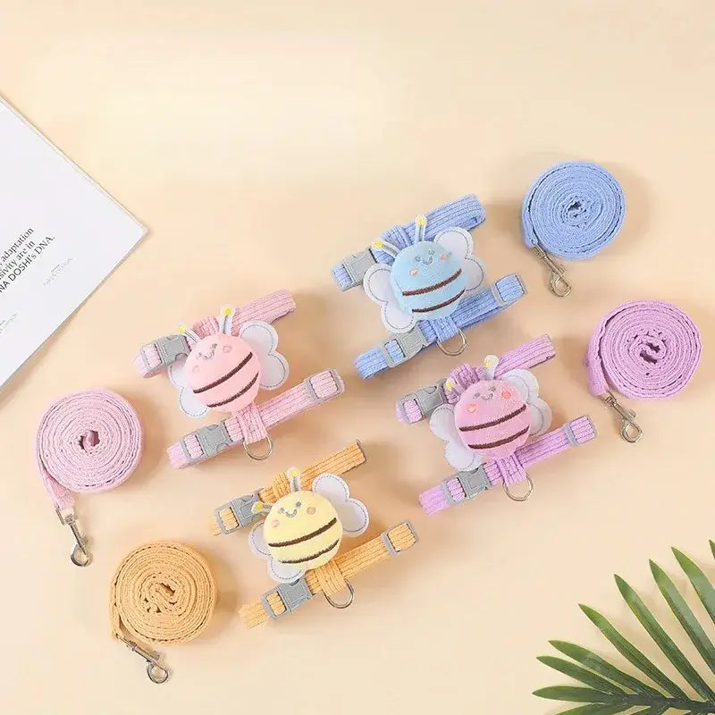 Colorful bee-themed pet harnesses with leashes.